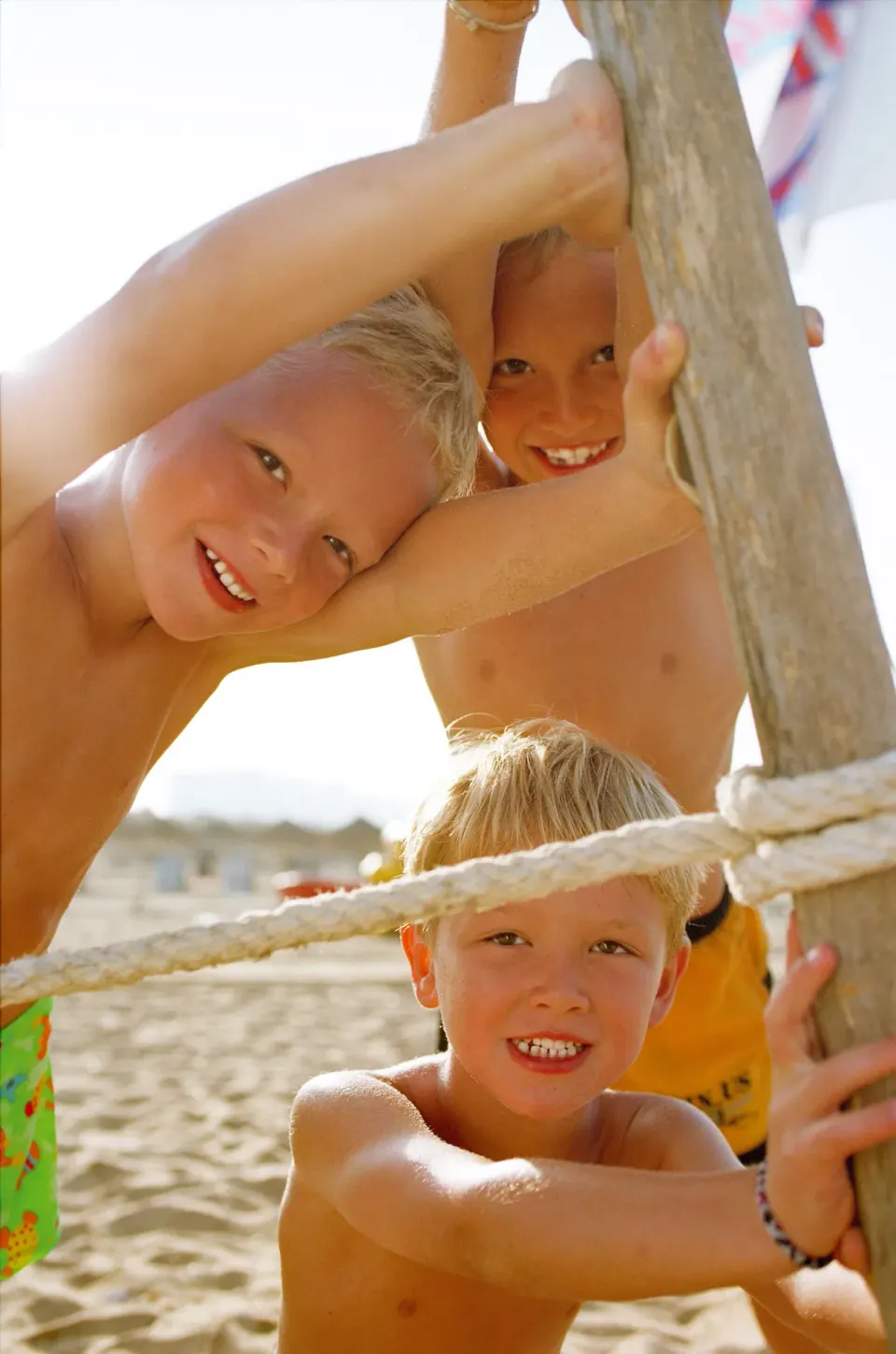 Children climb on a beach play structure at Allegro Playacar.