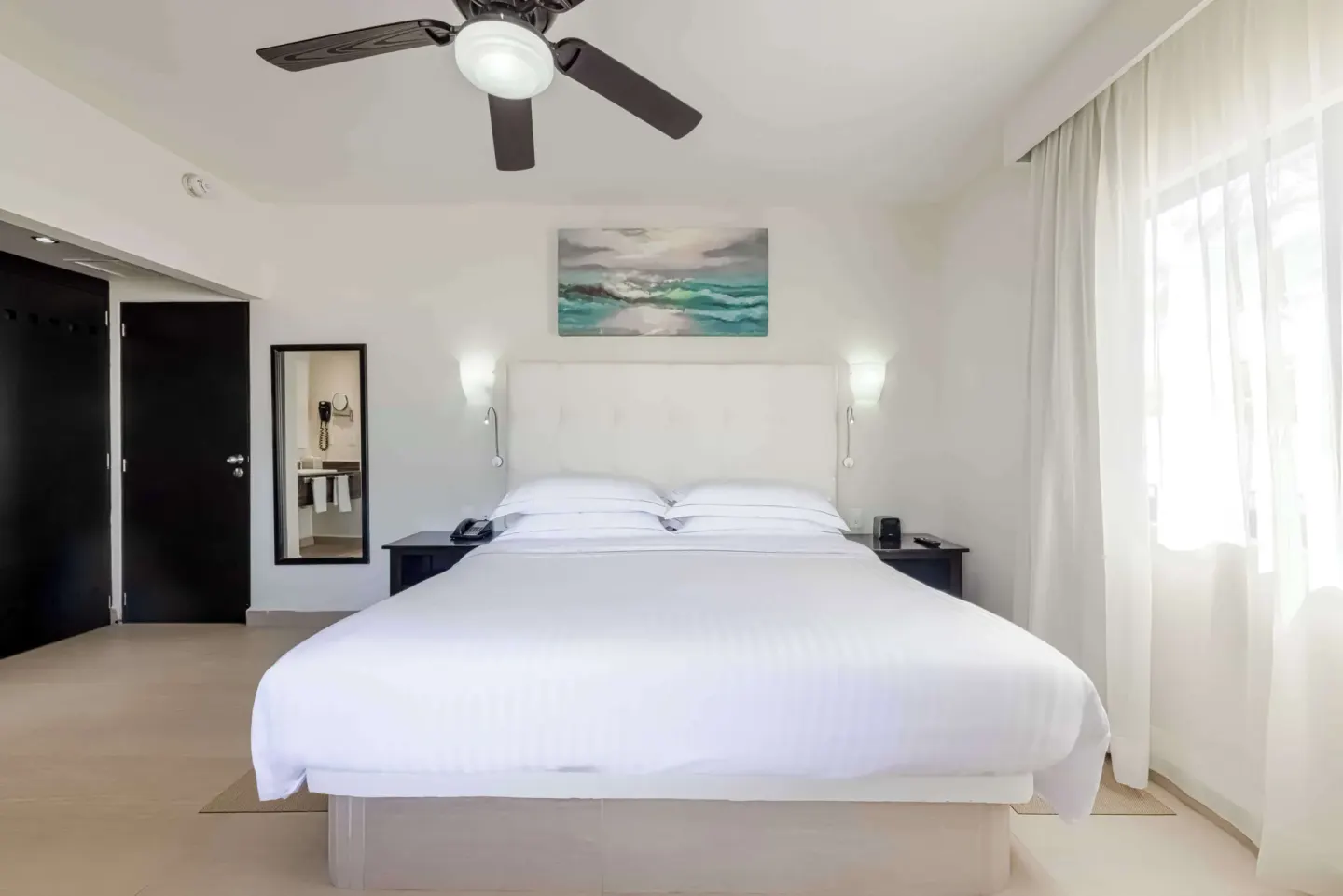 Superior Room with king bed and bright window at Allegro Playacar.