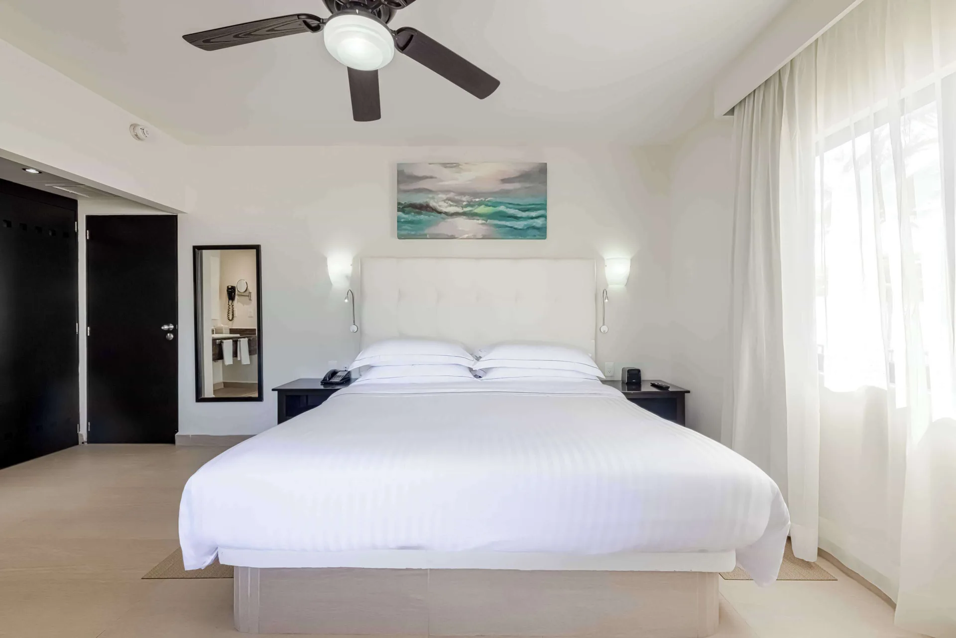 Superior Room with king bed and bright window at Allegro Playacar.