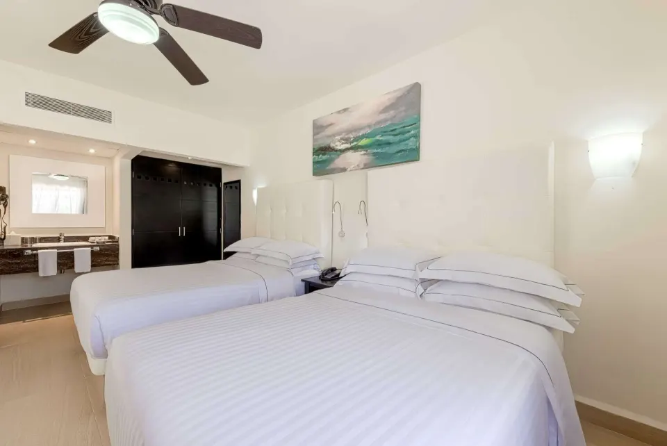 Superior Room with two double beds and open vanity at Allegro Playacar.