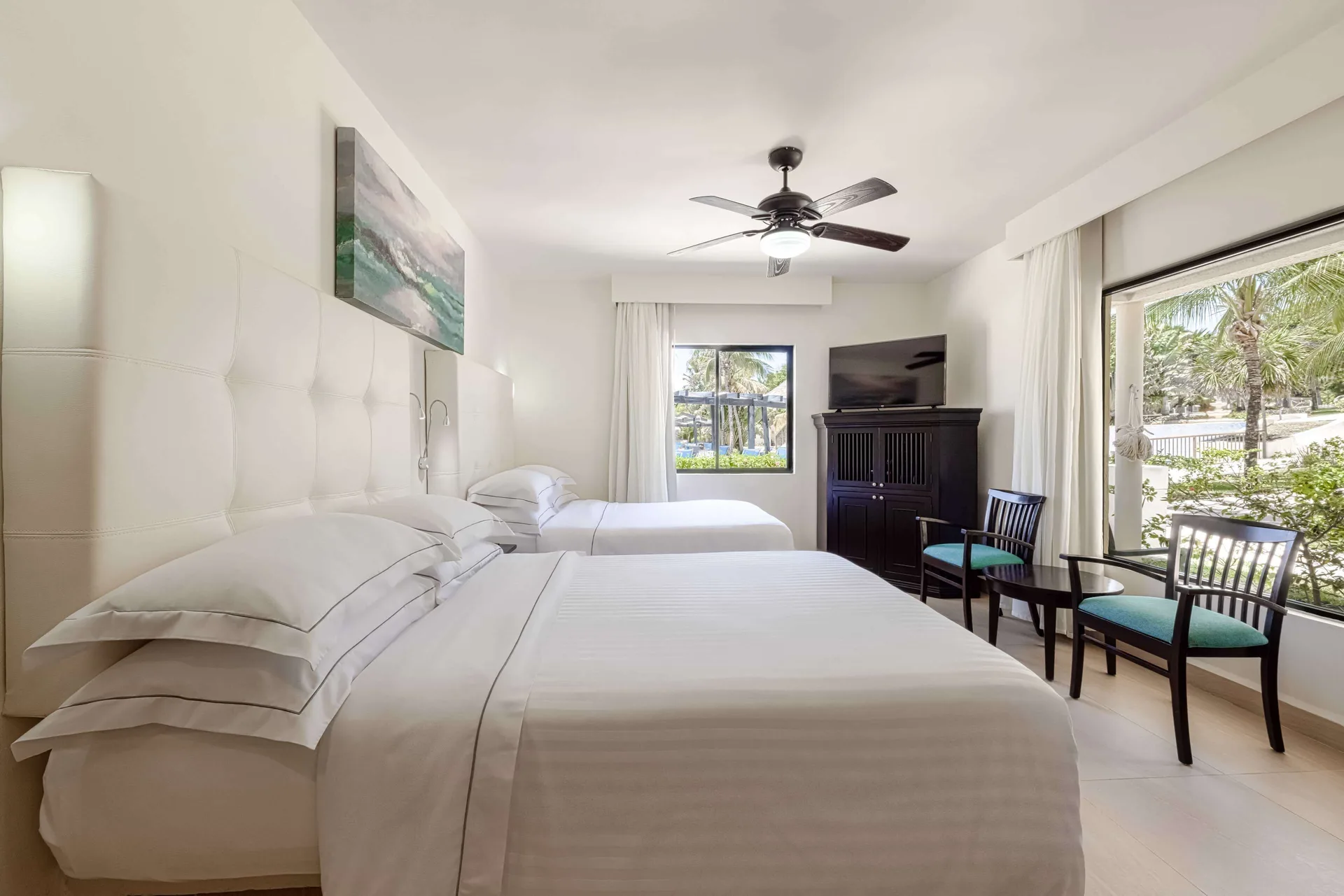 Superior Room with two double beds, seating, TV cabinet, and garden windows at Allegro Playacar.