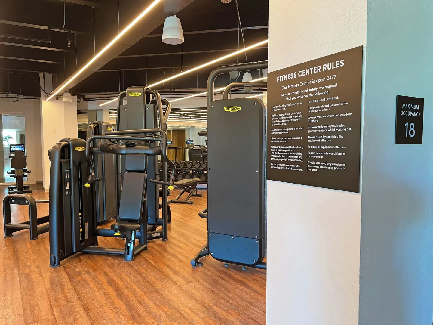 Fitness center strength machines and rules sign at Almare, a Luxury Collection Resort, Isla Mujeres.
