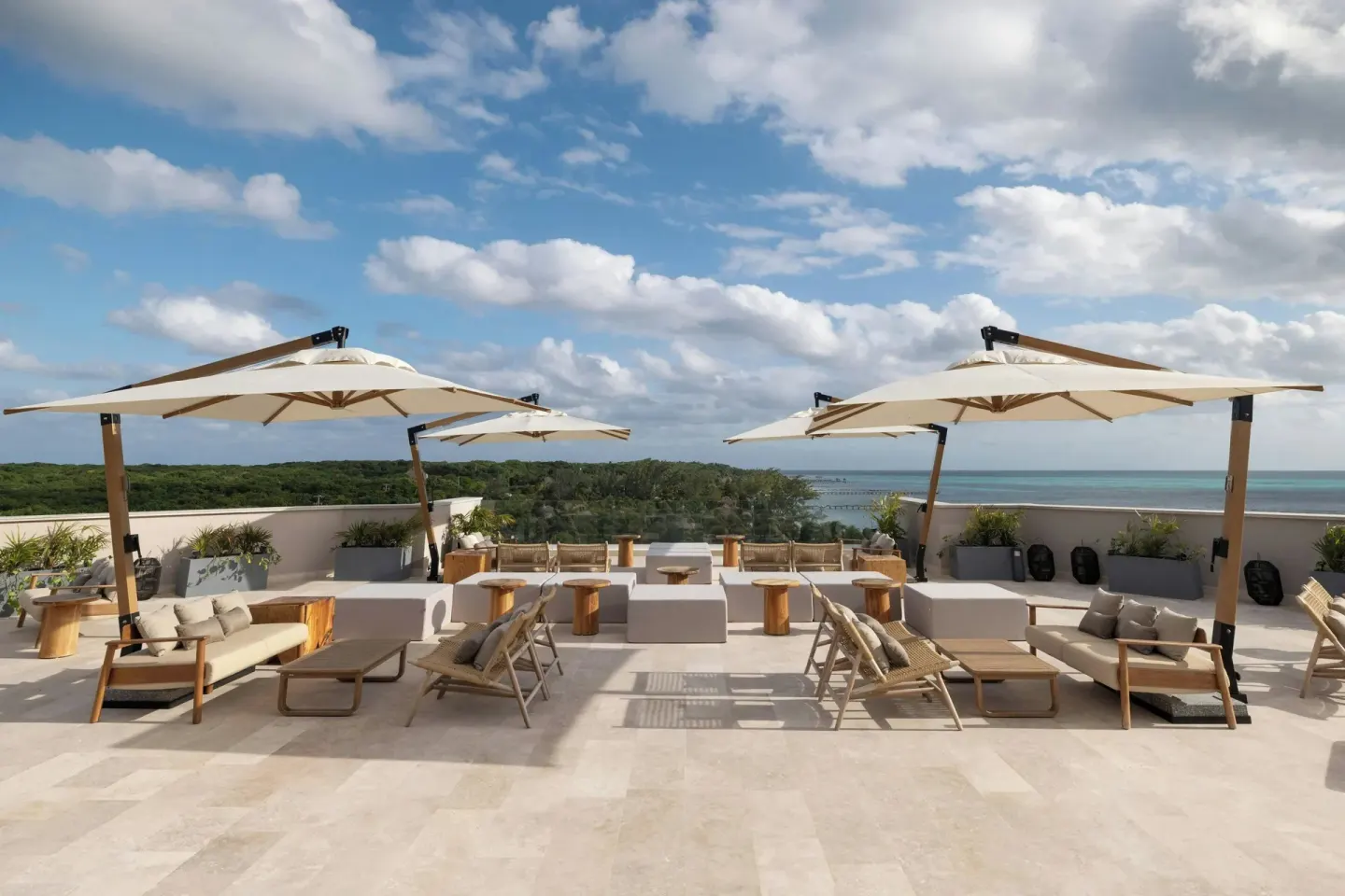 Rooftop terrace seating with umbrellas at Almare, a Luxury Collection Resort, Isla Mujeres.