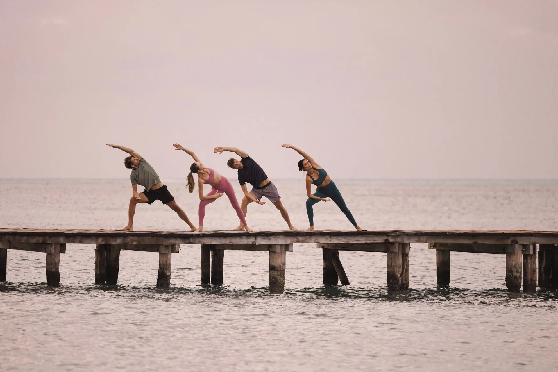 Group yoga session on a seaside pier at Almare, a Luxury Collection Resort, Isla Mujeres.