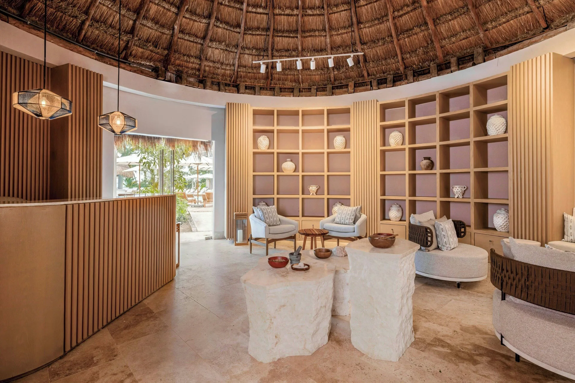 Round spa reception lounge with thatched ceiling at Almare, a Luxury Collection Resort, Isla Mujeres.