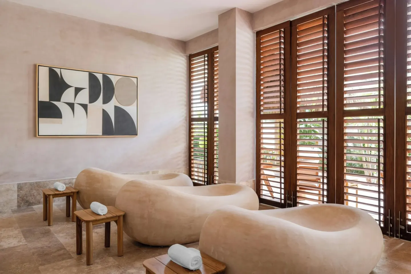 Curved spa loungers and wood shutters at Almare, a Luxury Collection Resort, Isla Mujeres.