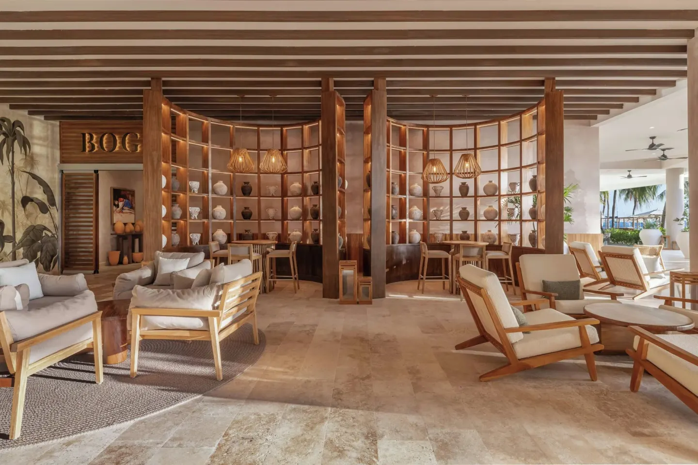 BOGA seating area with wood shelving at Almare, a Luxury Collection Resort, Isla Mujeres.