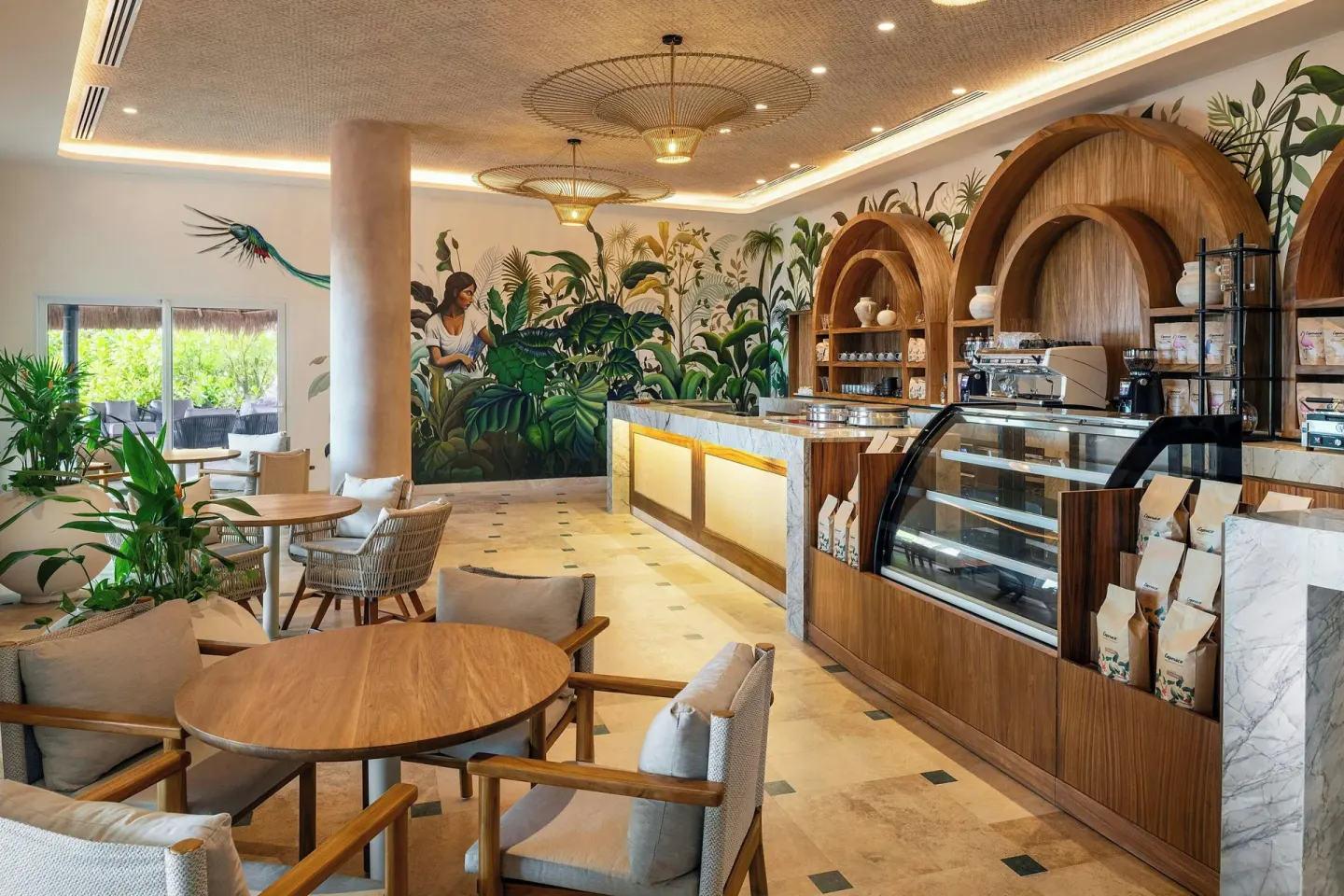 Cafe counter with pastry case and tropical mural at Almare, a Luxury Collection Resort, Isla Mujeres.