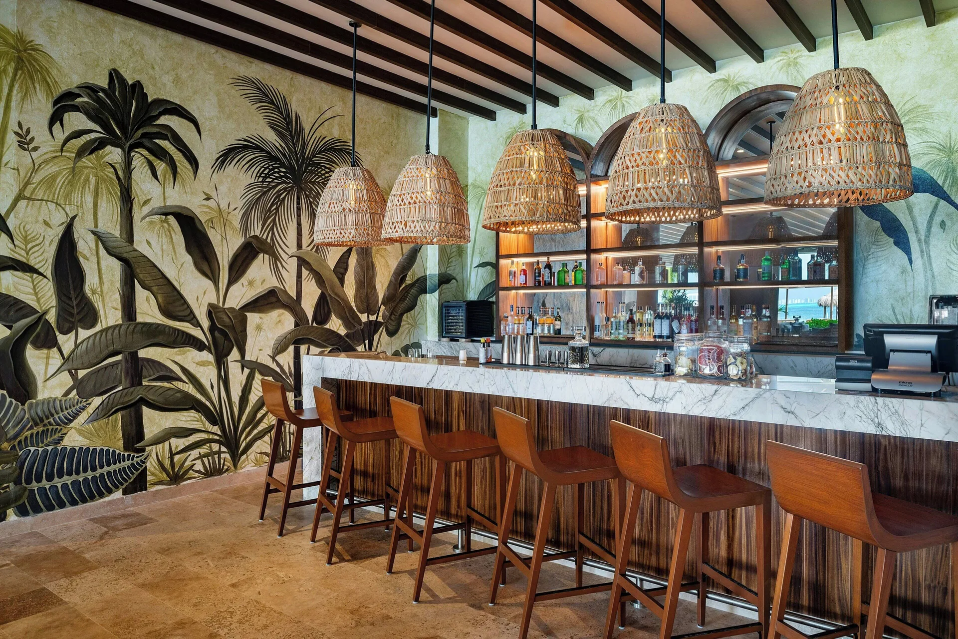 Bar counter with wicker pendant lights at Almare, a Luxury Collection Resort, Isla Mujeres.