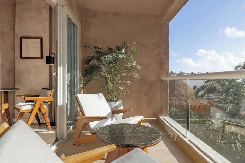 Private balcony seating for a Deluxe Ocean View room at Almare, a Luxury Collection Resort, Isla Mujeres.