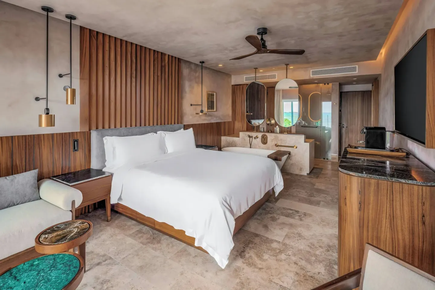 Deluxe Room with king bed, seating, tub and media console at Almare, a Luxury Collection Resort, Isla Mujeres.