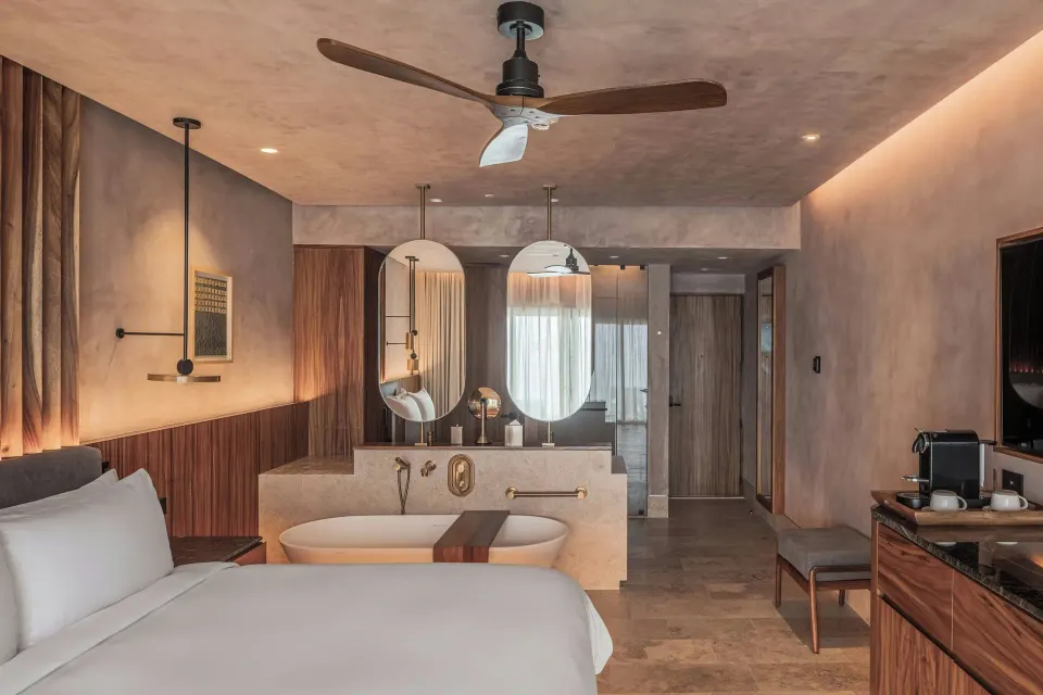 Deluxe Room with king bed, open tub, mirrors and coffee station at Almare, a Luxury Collection Resort, Isla Mujeres.