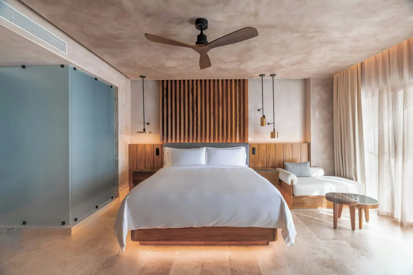 Junior Suite king bed and lounge area at Almare, a Luxury Collection Resort, Isla Mujeres.