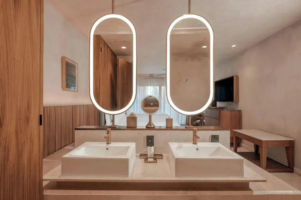 Standard Room balcony bath vanity with twin sinks and lit mirrors at Almare, a Luxury Collection Resort, Isla Mujeres