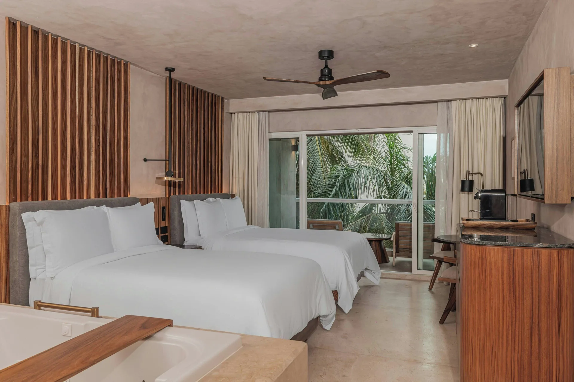 Standard Room Balcony with two beds and sliding glass doors at Almare, a Luxury Collection Resort, Isla Mujeres.