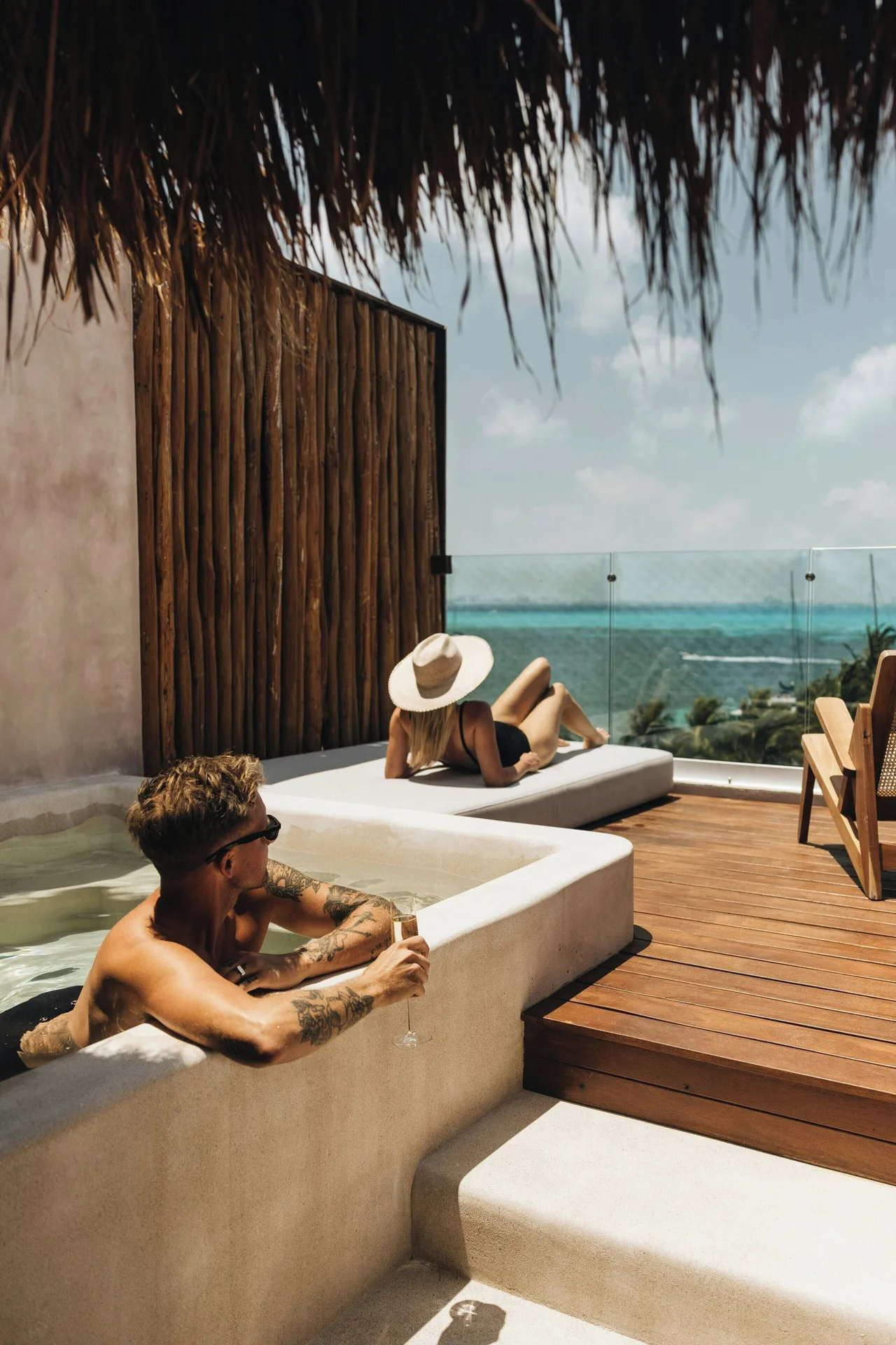 Guests relax by the plunge pool terrace of the Suite at Almare, a Luxury Collection Resort, Isla Mujeres.