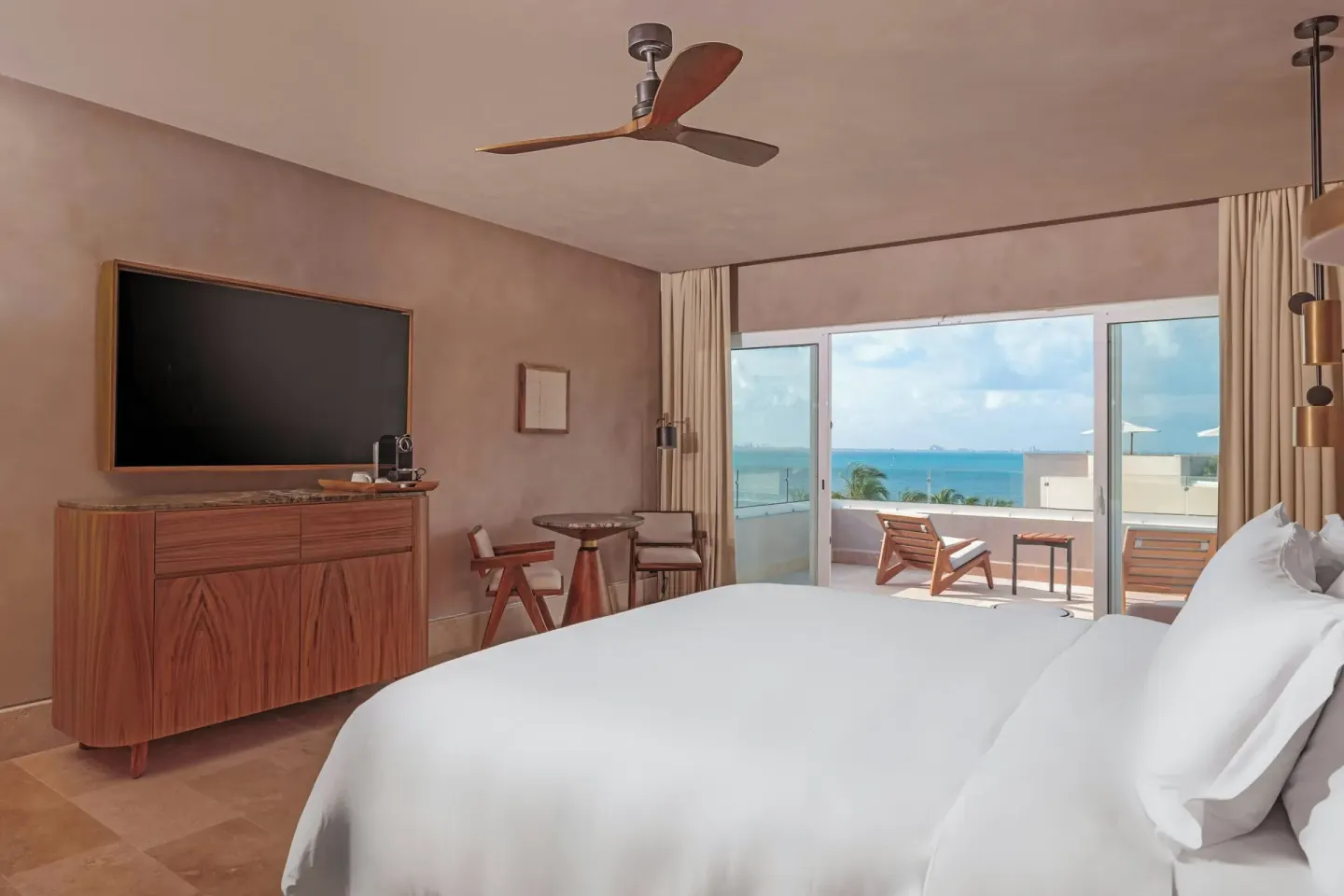 Ocean-view bedroom with balcony seating at Almare, a Luxury Collection Resort, Isla Mujeres.