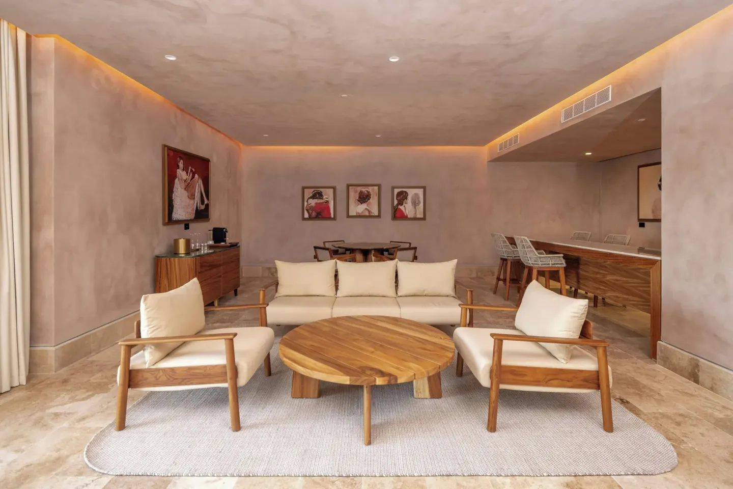 Suite living room with sofa, chairs, dining area, and bar at Almare, a Luxury Collection Resort, Isla Mujeres.