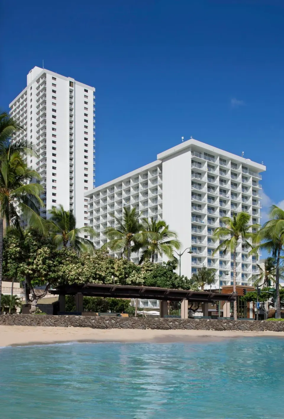 Twin resort towers overlook the beach at 'Alohilani Resort Waikiki Beach.