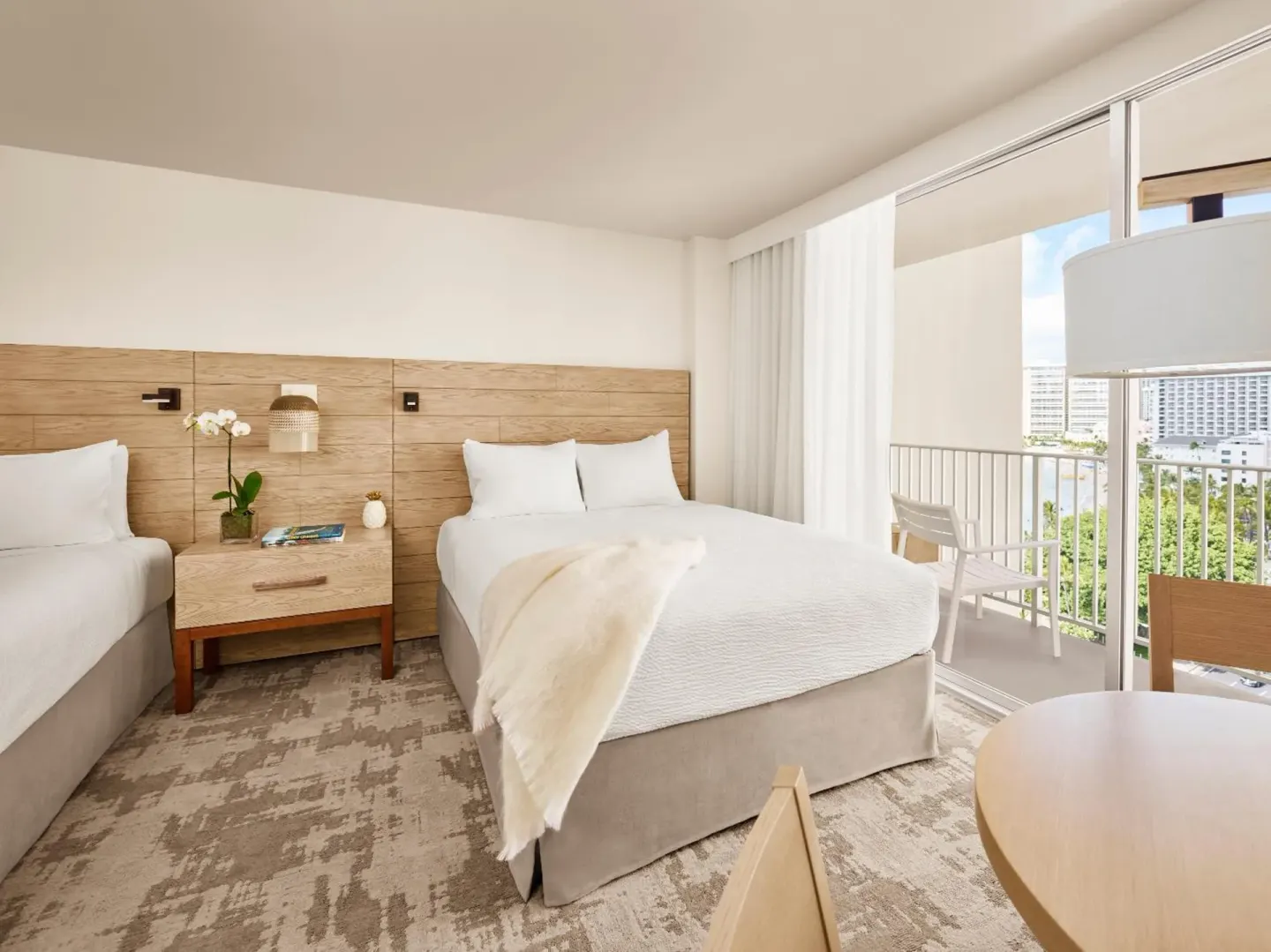 Guest room with two beds and a balcony at 'Alohilani Resort Waikiki Beach.