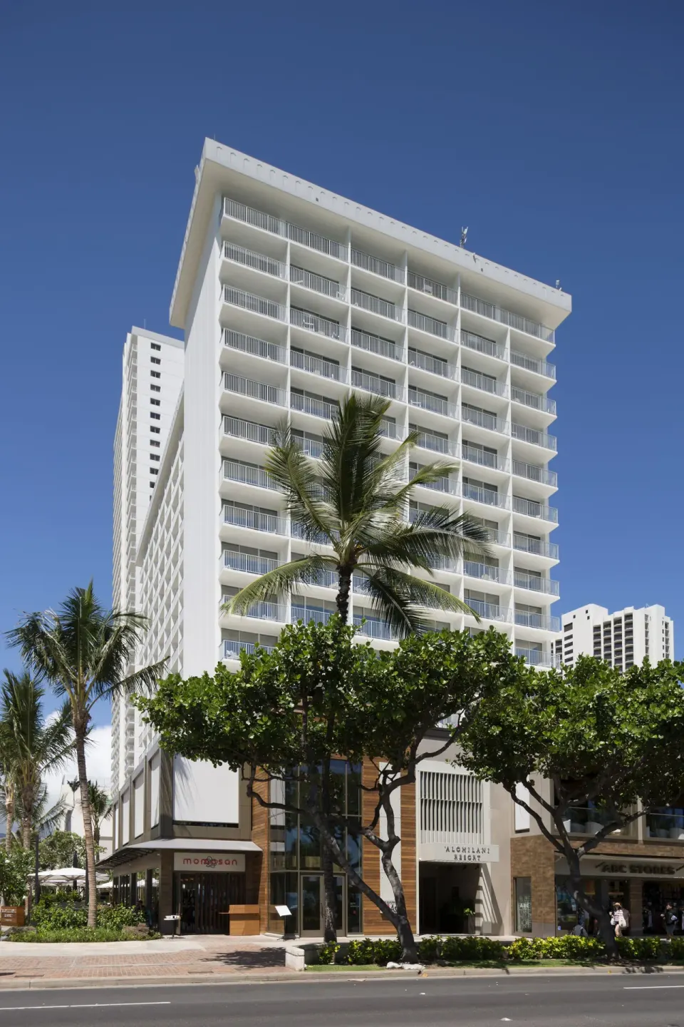 Street-level exterior and tower balconies at 'Alohilani Resort Waikiki Beach.