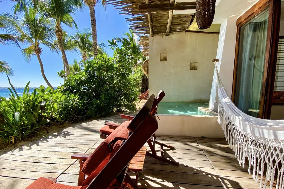 The Beach Tulum Hotel adults-oriented boutique beachfront hotel with oceanfront rooms and palm-shaded sand in Tulum, Mexico.