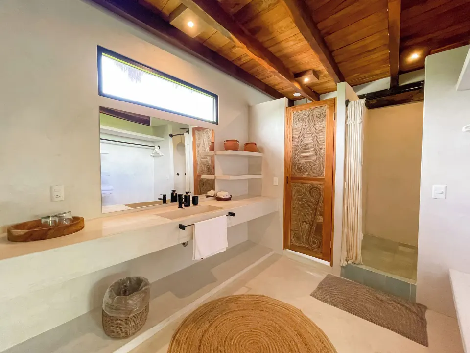 Garden Plus en-suite bathroom with long vanity and walk-in shower at Amansala