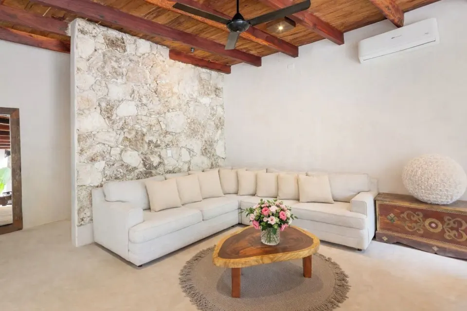 L-shaped sofa and coffee table in a sitting area in Town House Shanti at Amansala