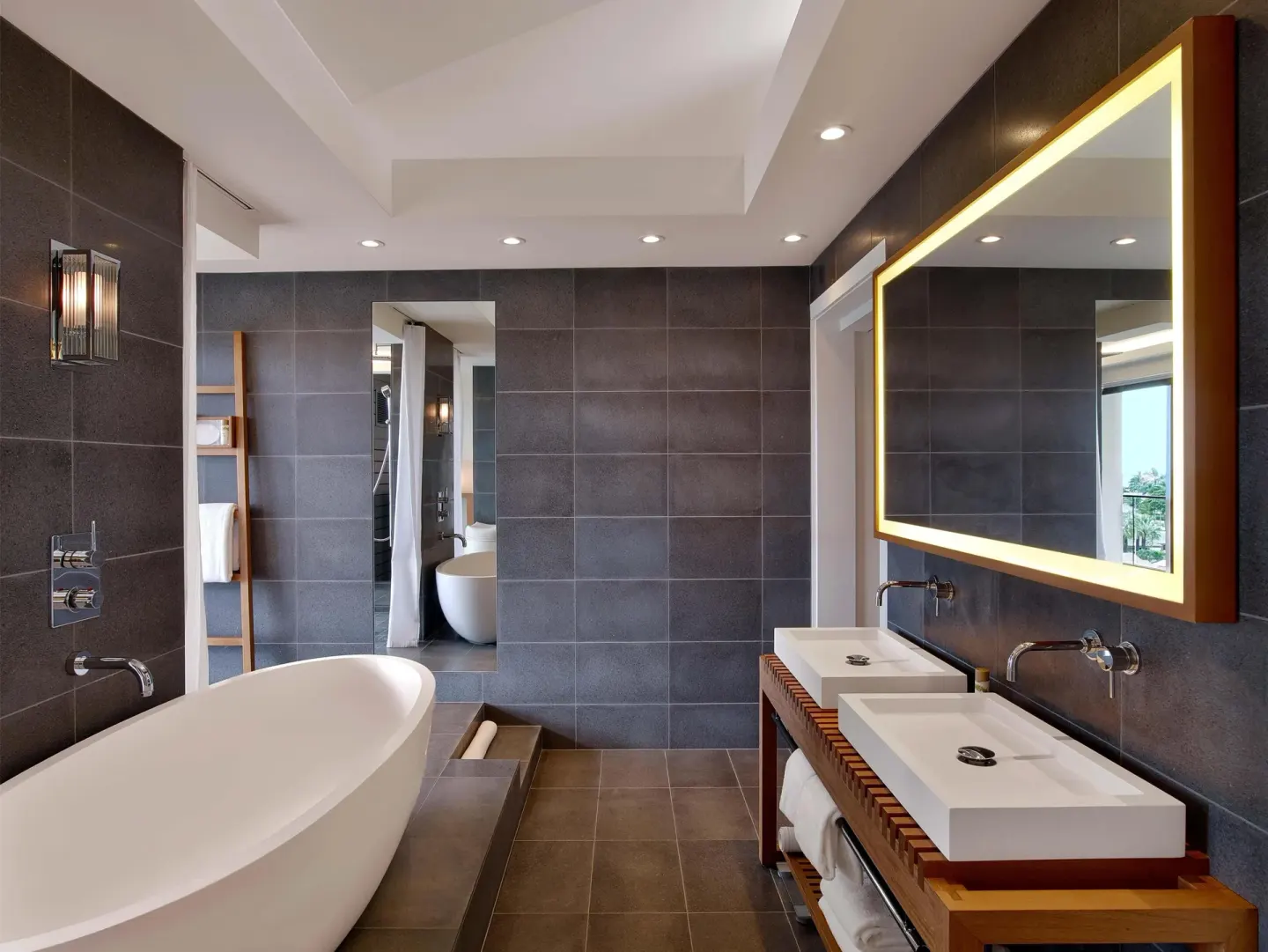 Bathroom with freestanding tub and double vanity at Andaz Maui at Wailea Resort.