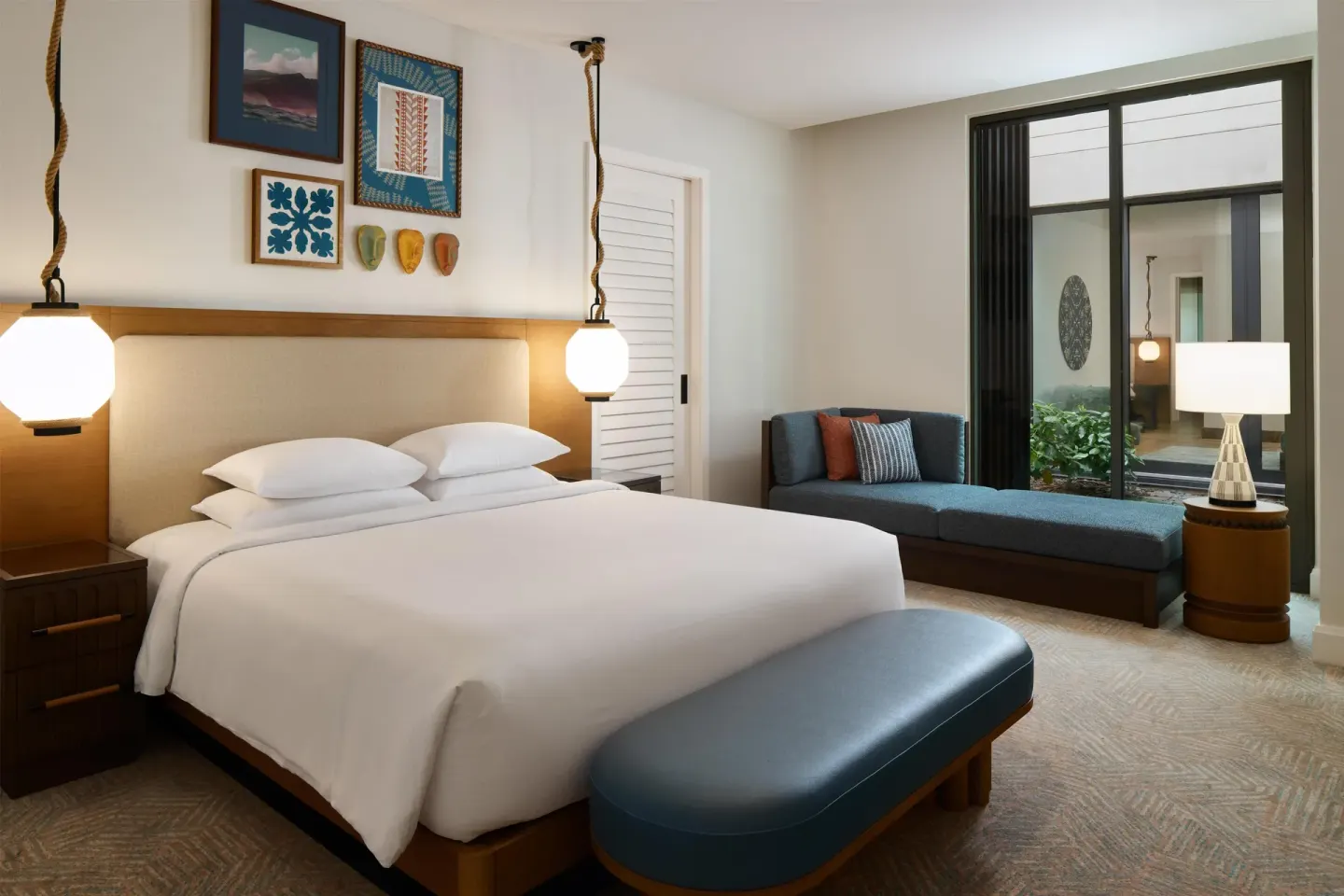 King guest room with chaise lounge and interior courtyard view at Andaz Maui at Wailea Resort.
