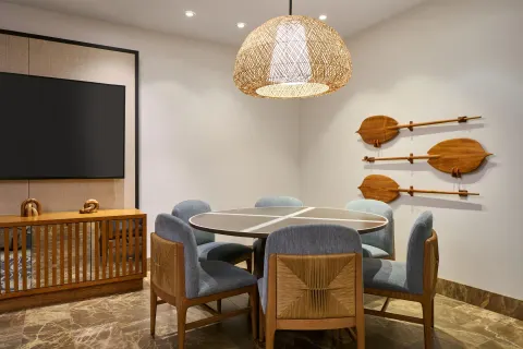 Game table room with wall-mounted paddles at Andaz Maui at Wailea Resort.