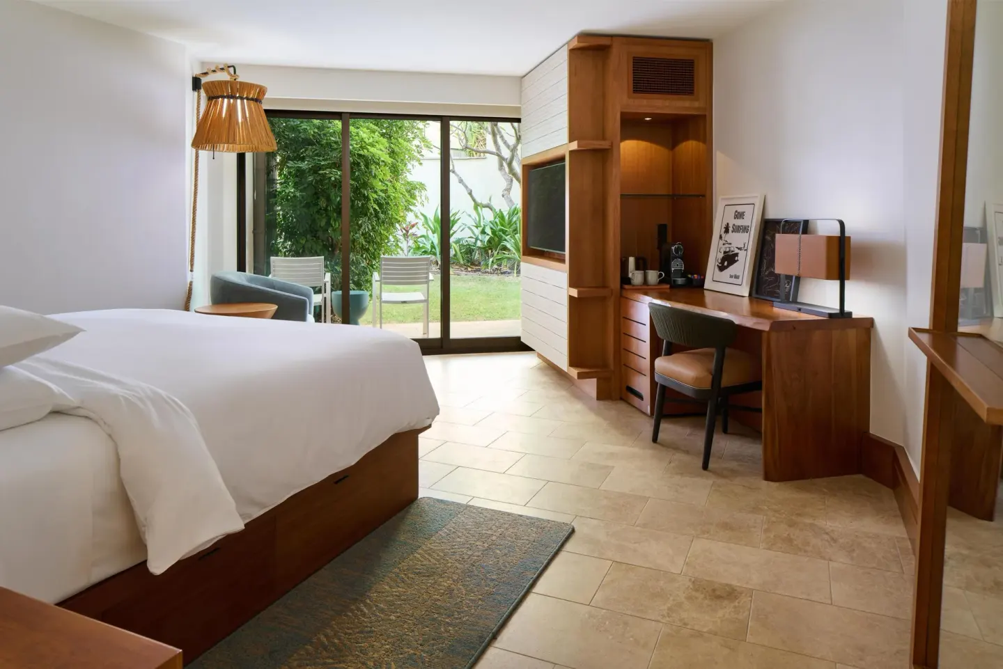 King guest room with desk, coffee station, and garden patio at Andaz Maui at Wailea Resort.