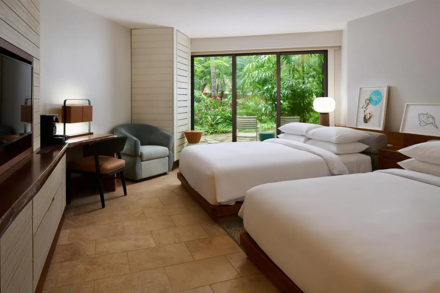 Two-bed guest room with desk and garden-facing sliding doors at Andaz Maui at Wailea Resort.