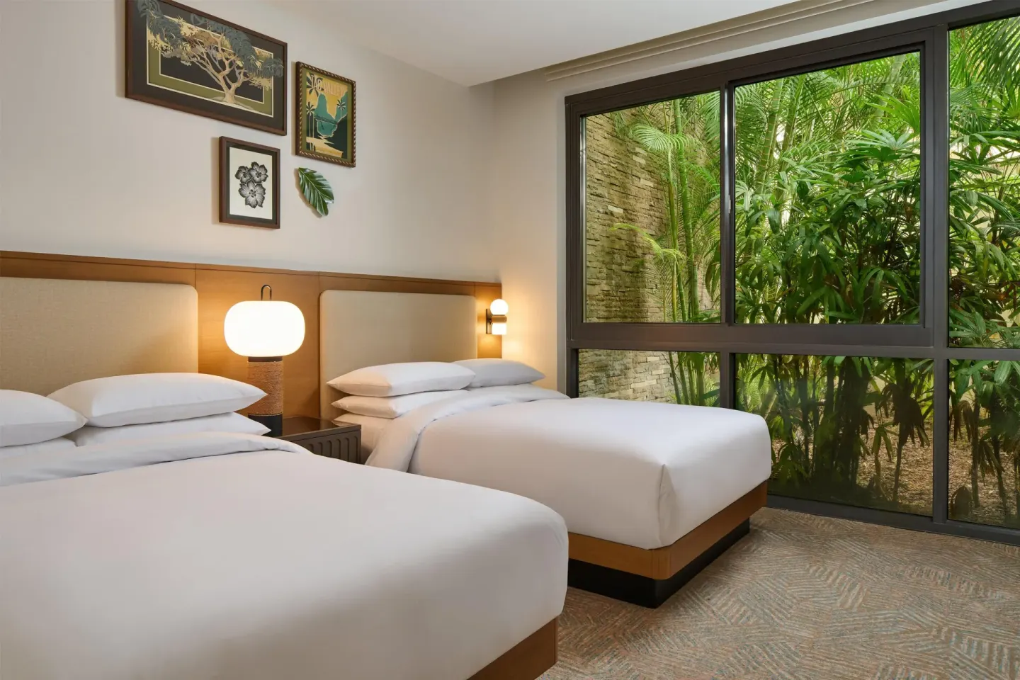 Two-bed guest room with garden-facing windows at Andaz Maui at Wailea Resort.
