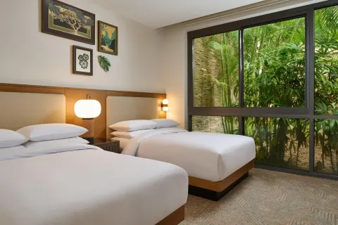 Two-bed guest room with garden-facing windows at Andaz Maui at Wailea Resort.