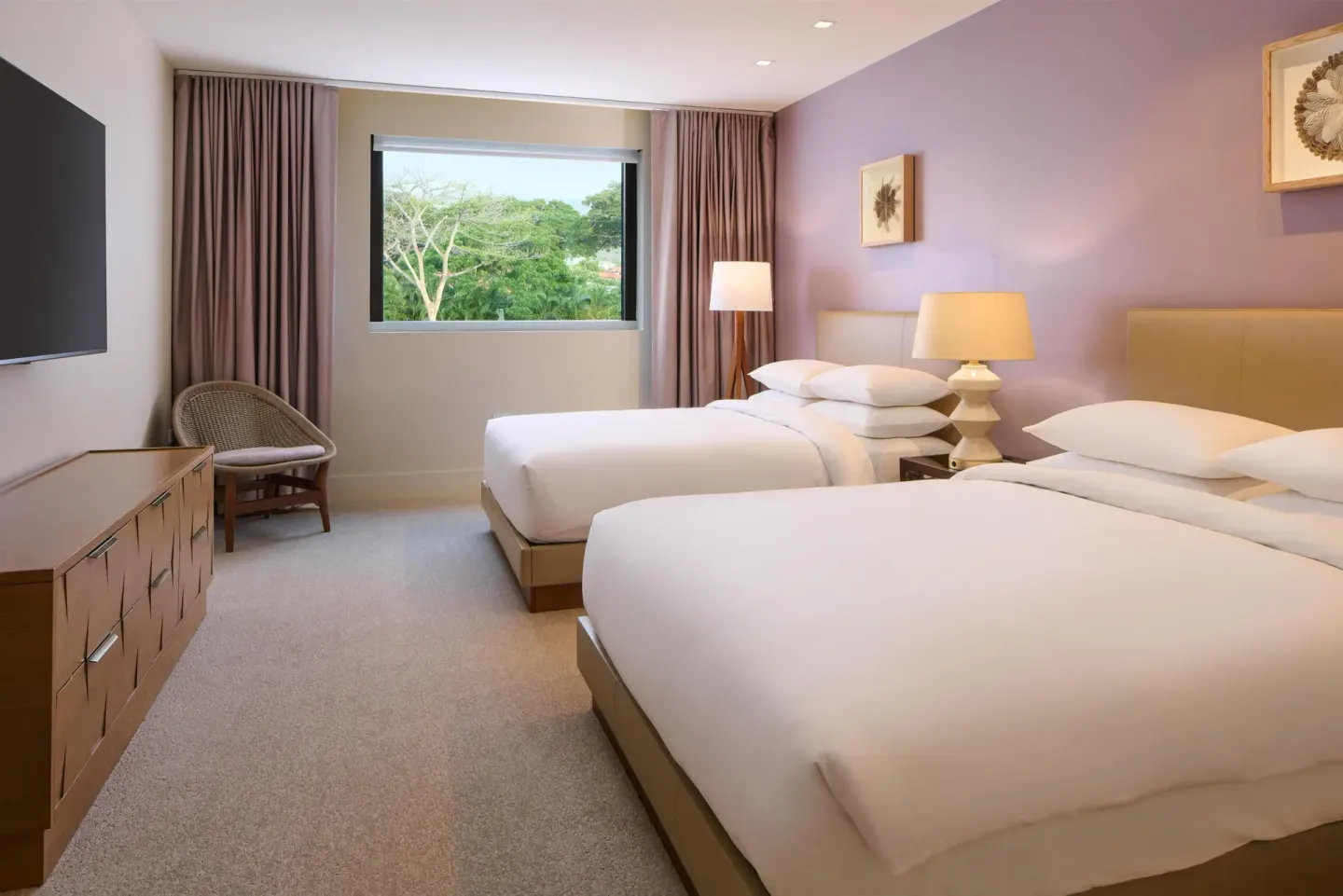 Guest room with two beds and a large window at Andaz Maui at Wailea Resort.