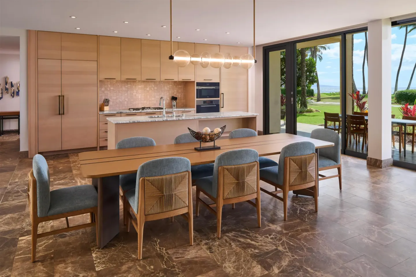 Suite dining area with kitchen and patio view at Andaz Maui at Wailea Resort.