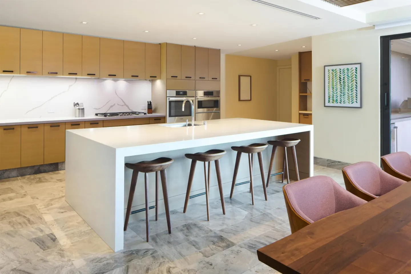Suite kitchen with large island and bar stools at Andaz Maui at Wailea Resort.