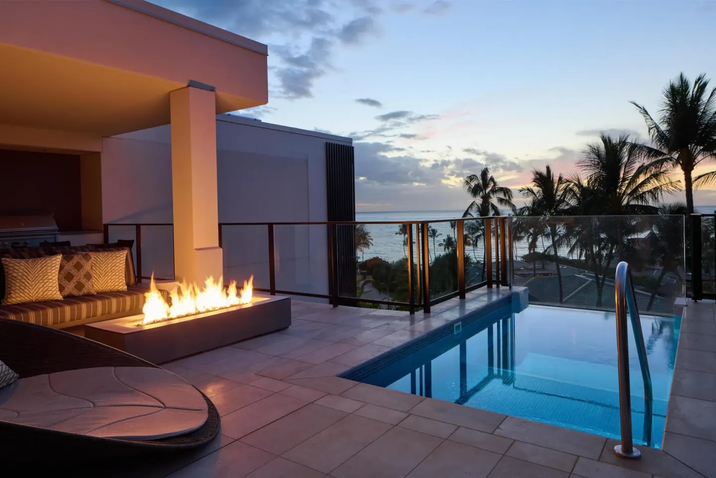 Private terrace plunge pool with fire feature at Andaz Maui at Wailea Resort.