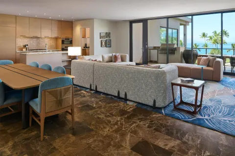Villa living room, dining table, kitchen, and ocean-view lanai at Andaz Maui at Wailea Resort.