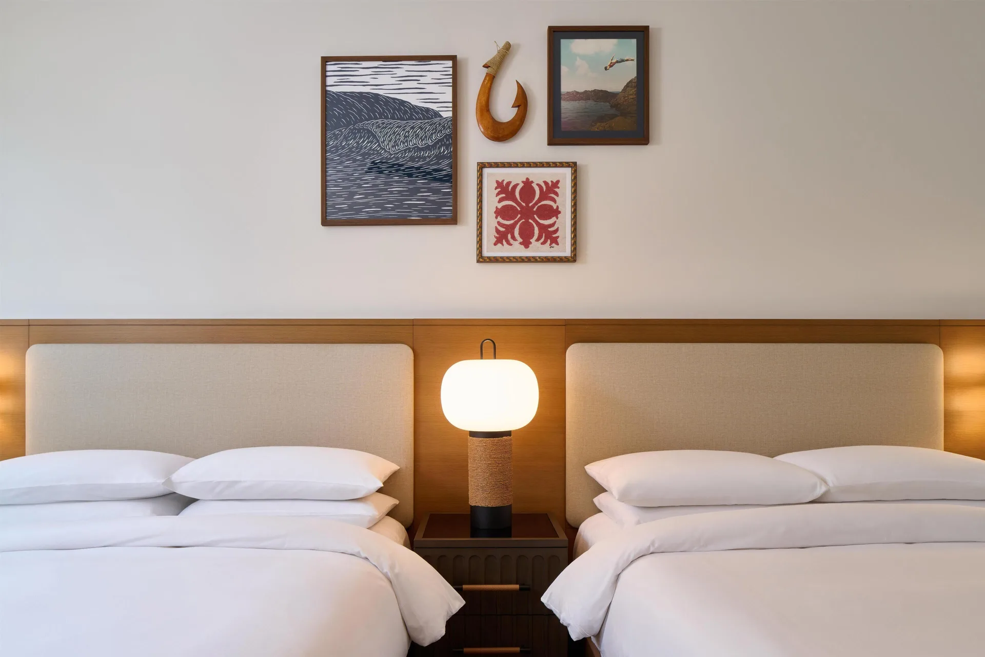 Close view of two-bed villa bedroom with island wall art at Andaz Maui at Wailea Resort.