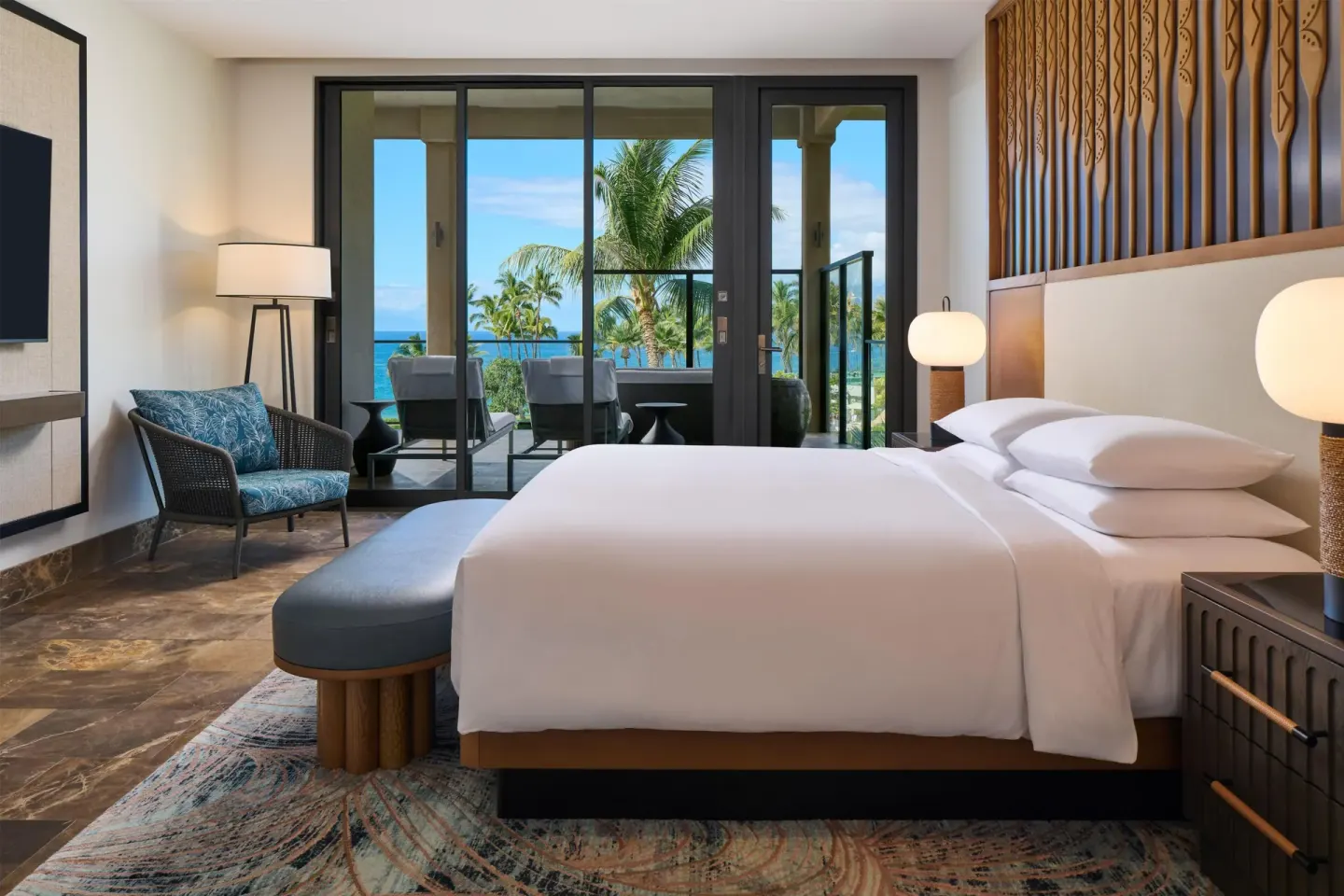 King bedroom with ocean-view balcony in a villa at Andaz Maui at Wailea Resort.