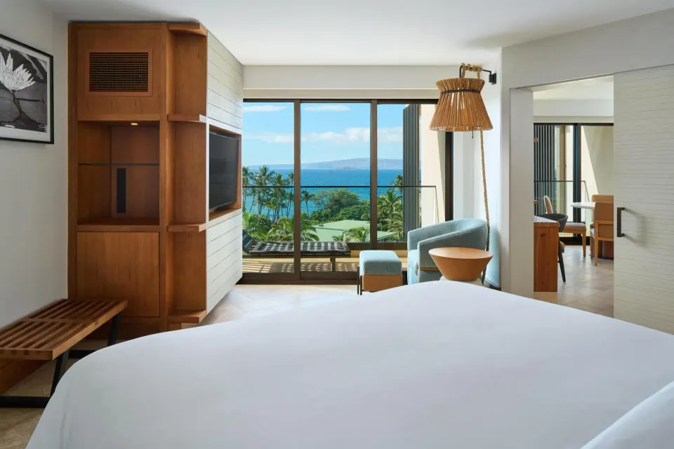 Ocean View Suite king bed and balcony view at Andaz Maui at Wailea Resort.