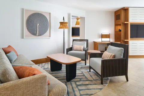 Ocean View Suite living room with sofa and armchairs at Andaz Maui at Wailea Resort.