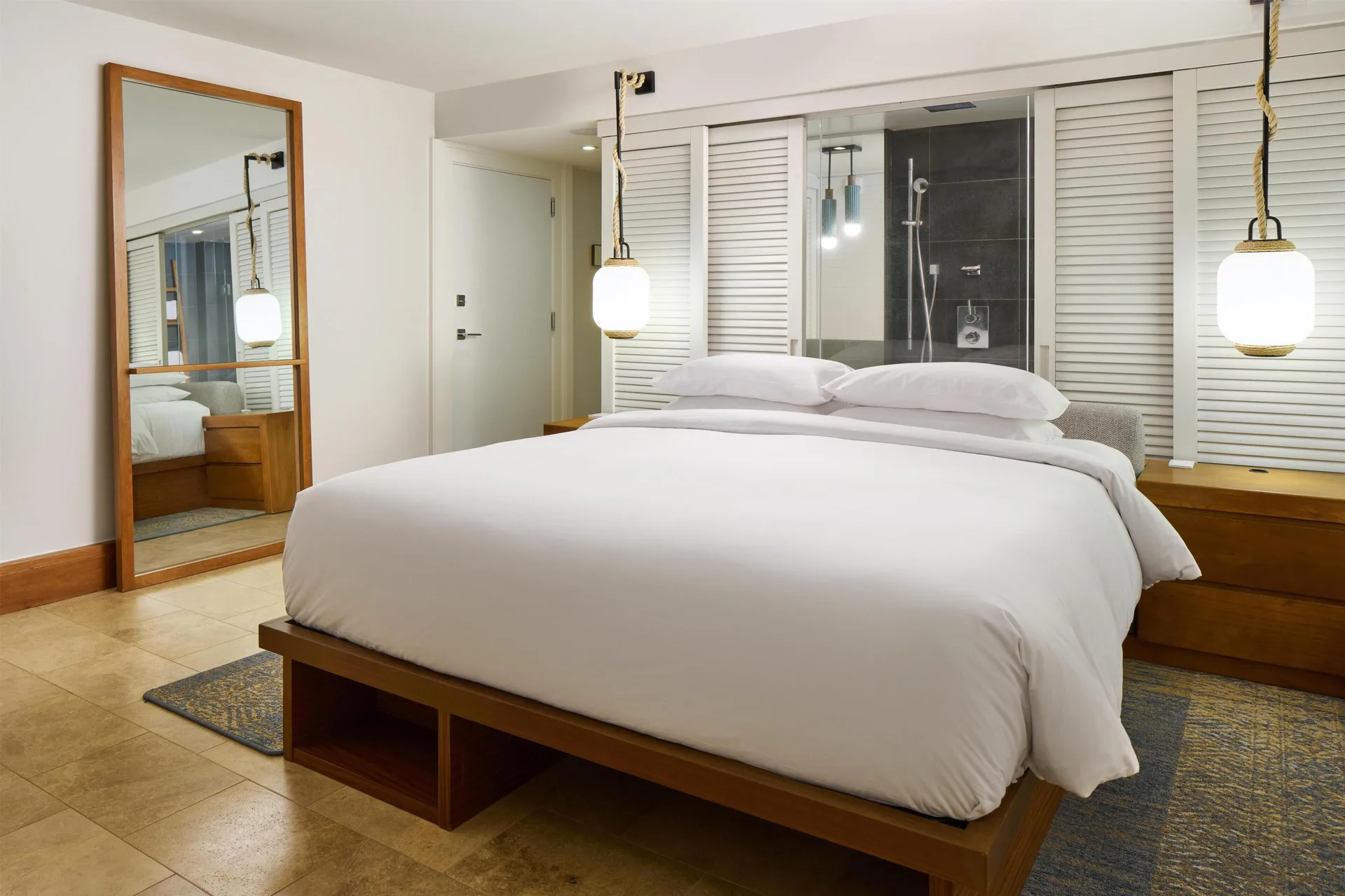 King bed guest room with shower window at Andaz Maui at Wailea Resort.