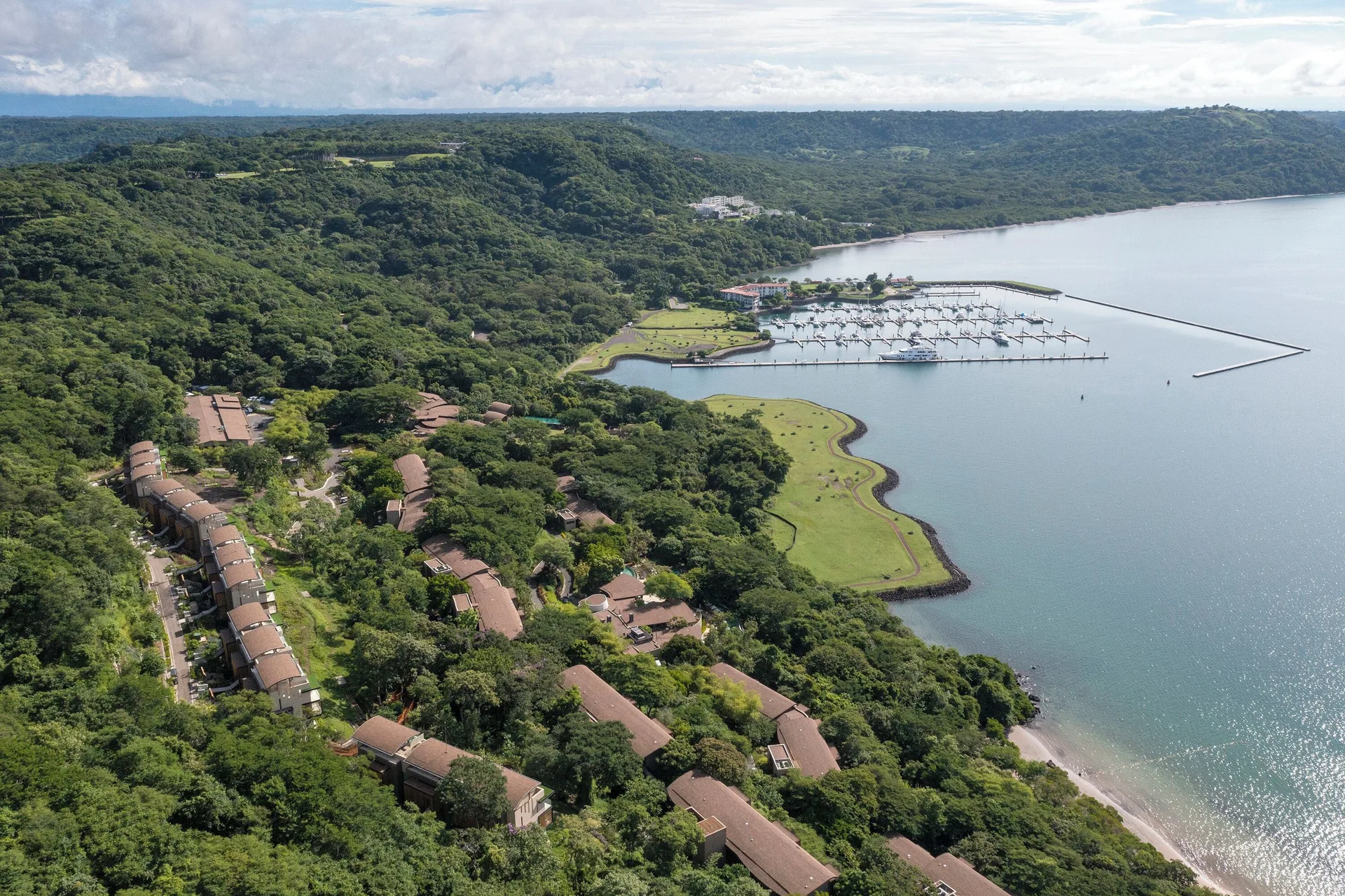 Aerial view of resort buildings, marina and bay at Andaz Peninsula Papagayo Resort, Costa Rica.