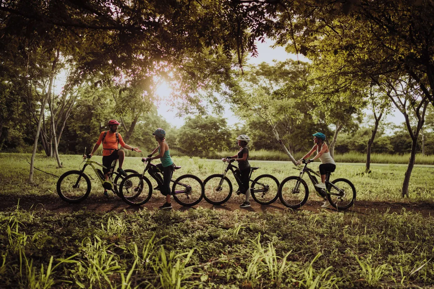 Cyclists pause on a shaded trail at Andaz Peninsula Papagayo Resort, Costa Rica.