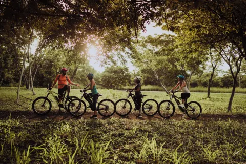 Cyclists pause on a shaded trail at Andaz Peninsula Papagayo Resort, Costa Rica.