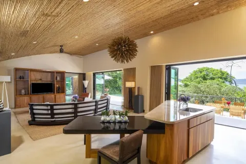 Open villa living room and kitchen at Andaz Peninsula Papagayo Resort, Costa Rica.