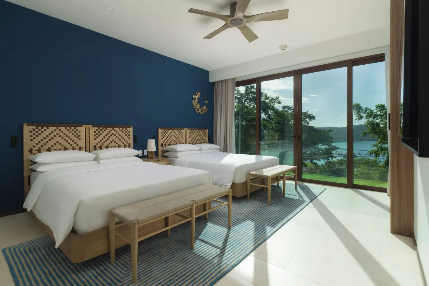 Two-bed penthouse bedroom with bay view at Andaz Peninsula Papagayo Resort, Costa Rica.